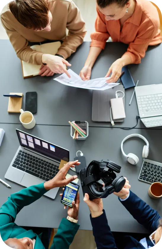 Colleagues reviewing documents at a shared desk